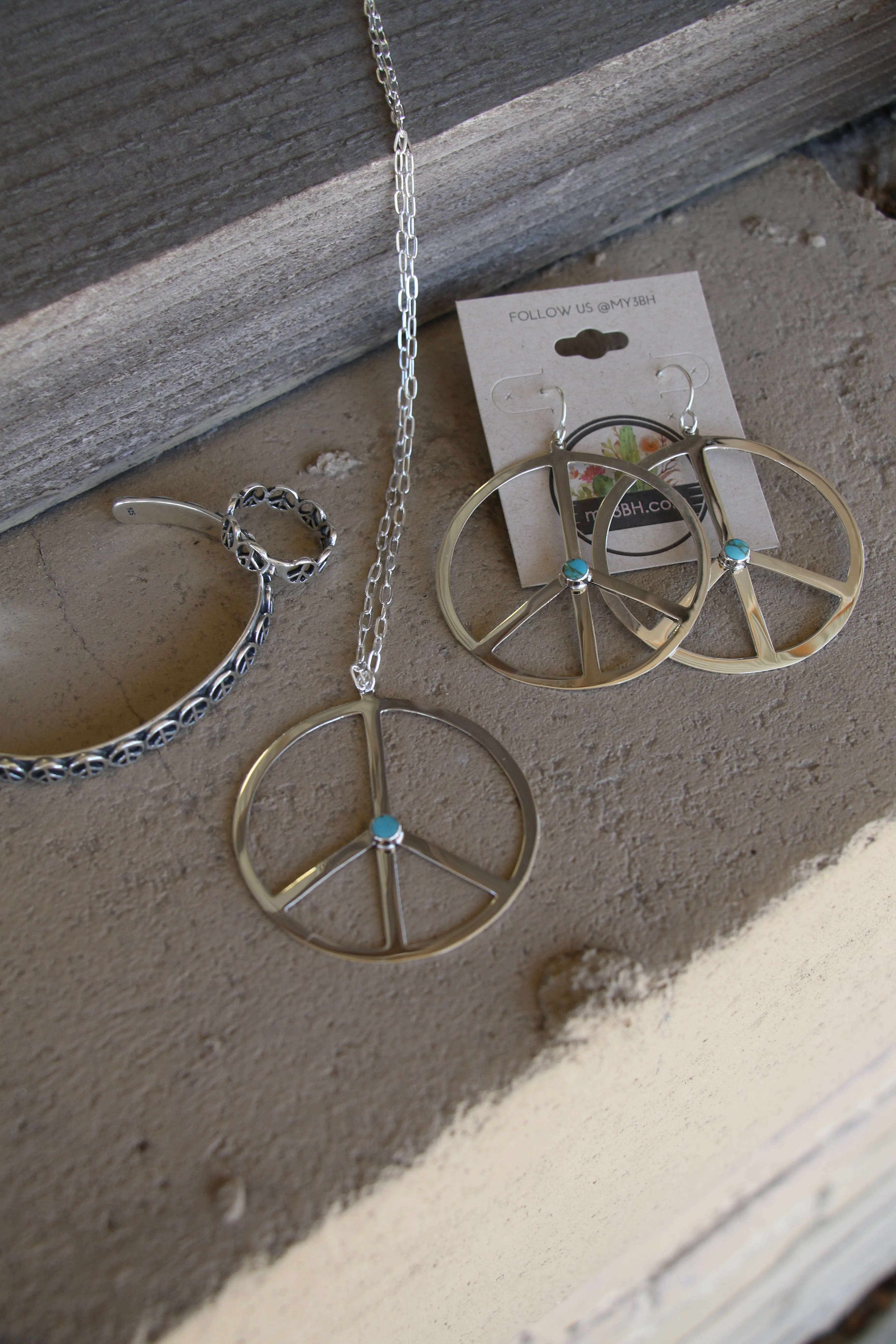 1239 -TQ SILVER PEACE EARRINGS