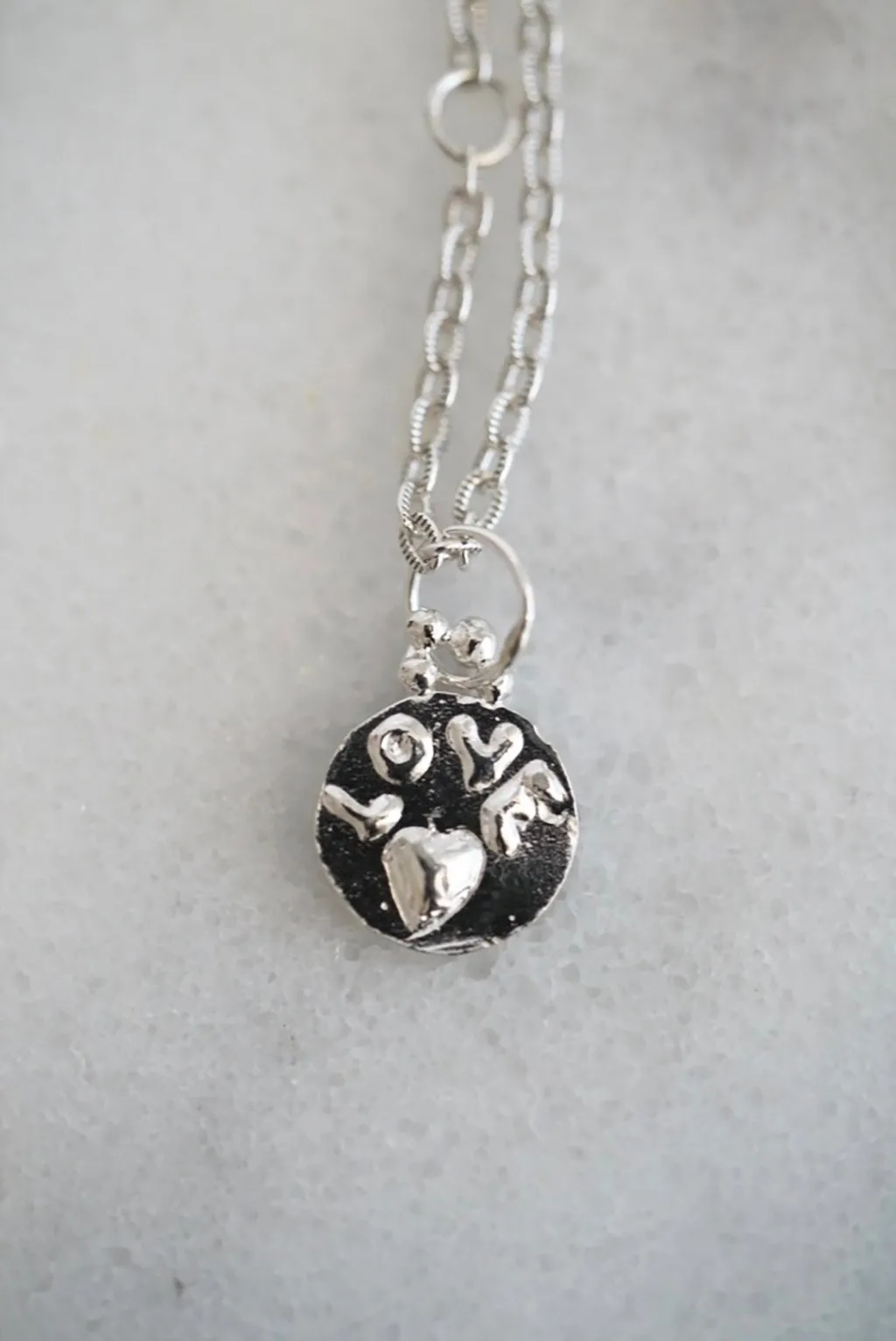 Love medallion necklace in silver